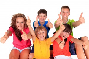 Teens and kids with thumbs up